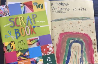 A picture of a COVID-19 scrapbook with a child's drawing of a rainbow