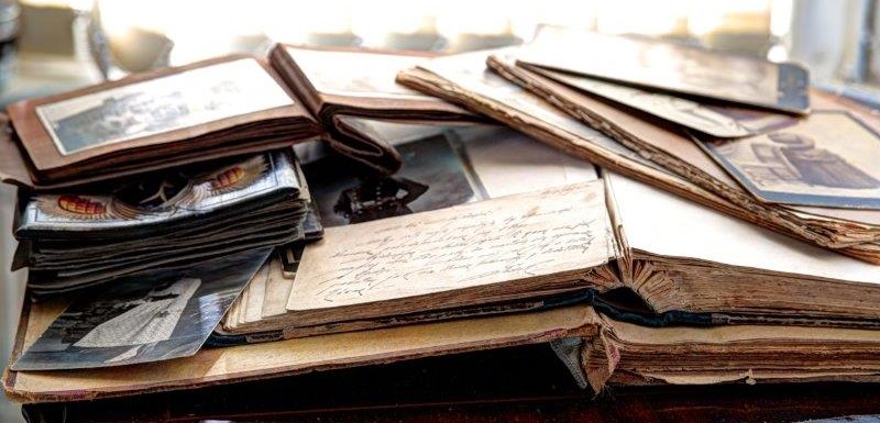 A pile of old family photo albums and diaries, 